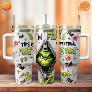 Set of three The Grinch Movies Stanley Tumblers with varied designs, including one with the Grinch's face.