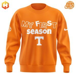 Close-up of orange Tennessee Lady Vols "My First Season" crewneck sweatshirt with white lettering.