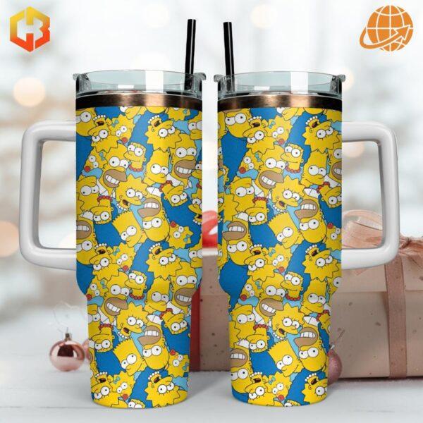 Two Simpsons Stanley Tumblers with holiday decor background