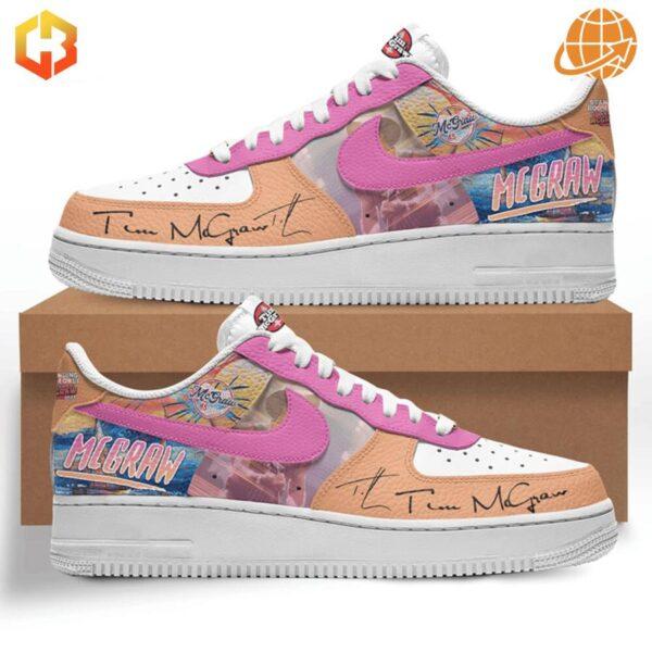 Side view of Tim McGraw Nike Air Force Shoes with pink swoosh and McGraw-themed graphics.