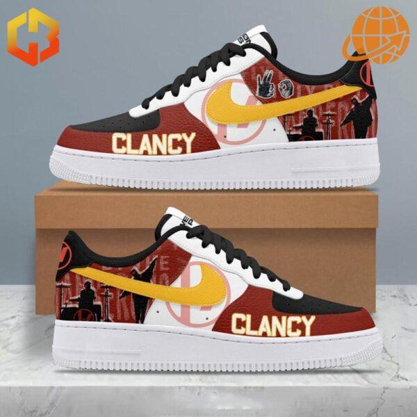 Side view of Twenty One Pilots Clancy Nike Air Force Shoes with red, black, and yellow design featuring the Clancy logo.