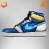 Vegeta Dragon Ball Air Jordan Shoe side view, blue and gold with glowing cyan Nike swoosh.