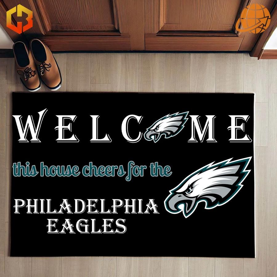 Welcome This House Cheers for the Philadelphia Eagles Doormat displayed with the Eagles logo and welcoming text.