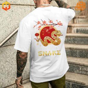 White t-shirt featuring a snake graphic for the Chinese New Year.