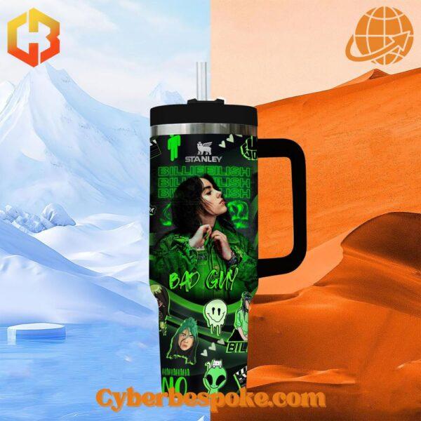 Billie Eilish Bad Guy Stanley Tumbler against a backdrop of snowy mountains and desert sands.