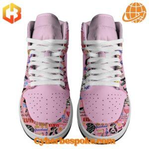 Front view of pink Elvis Presley-themed Air Jordan sneakers with white laces and perforated toe.