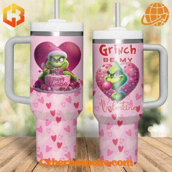 Two Grinch-themed Valentine's Day tumblers with heart designs