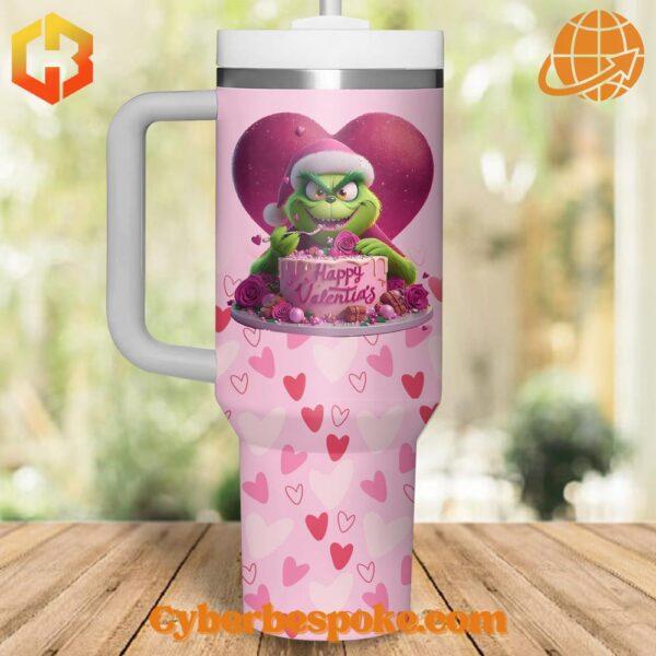 Pink Grinch Valentine's Day tumbler with cake design