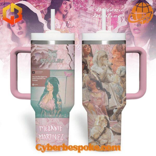 Front view of the Melanie Martinez Light Shower Stanley Tumbler Cup featuring pastel pink and purple collage design with floral patterns and butterflies.