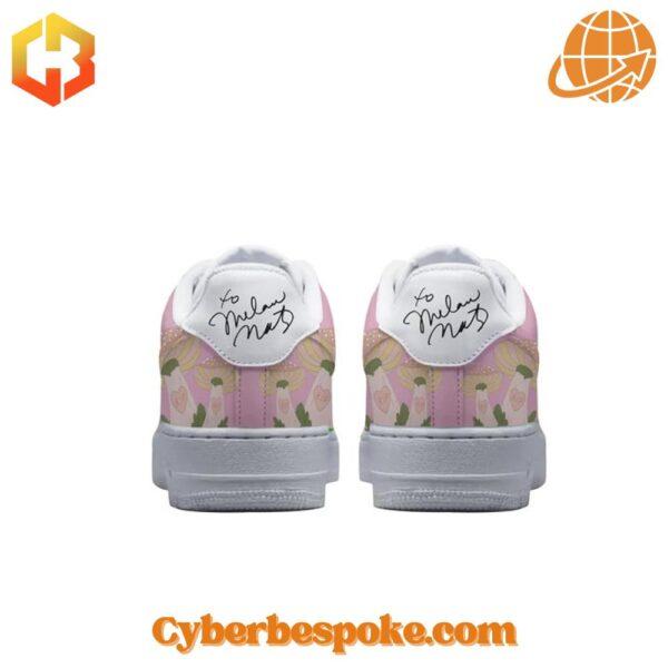 Back view of Melanie Martinez Pink Nike Air Force 1 Shoes showing Melanie Martinez's signature and playful pastel patterns.