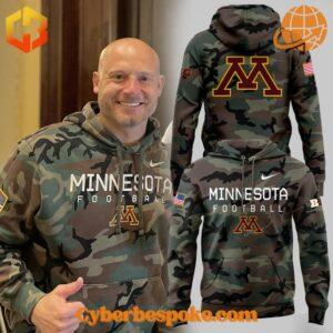 Minnesota Golden Gophers Military Appreciation camo hoodie featuring team logo and American flag patch on sleeve.