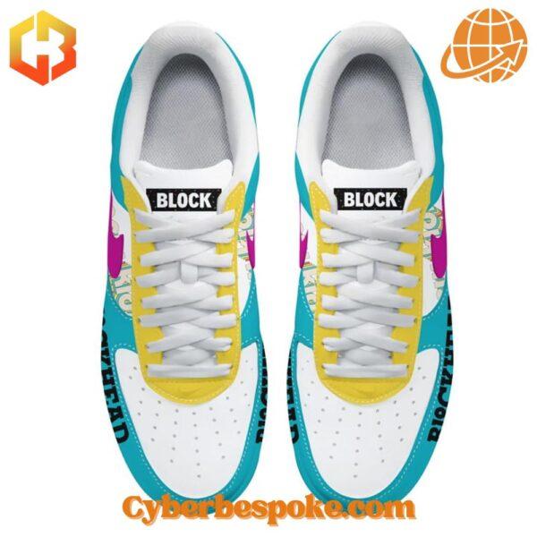 Top view of custom New Kids on the Block Nike Air Force 1 sneakers showing colorful design and "BLOCK" text on tongue.