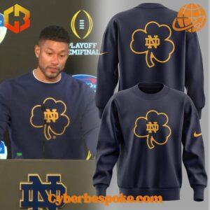 Notre Dame Coach Marcus Freeman hoodie with clover design, perfect for fans and supporters.