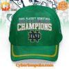 Front view of the Notre Dame Fighting Irish 2025 Orange Bowl Champions Hat featuring white and gold text, blue ND logo, and green base color.