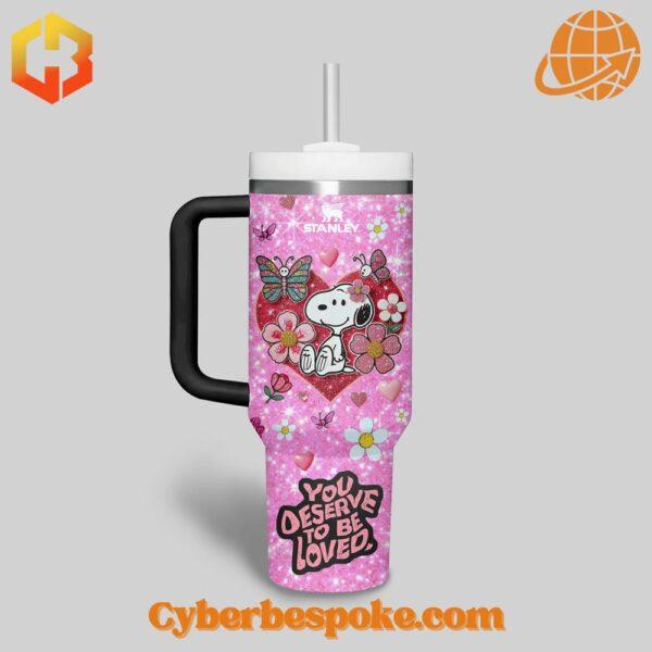 Close-up of Snoopy You Deserve To Be Loved Valentine Tumbler 40oz front design with hearts and flowers.