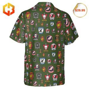 A stylish Hawaiian shirt with Top Gun insignia and aviation motifs blended with colorful island patterns