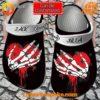 Customizable Crocs with skeleton hands and heart design, personalized straps.