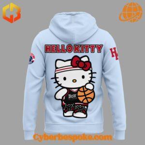 The image displays the back of the Washington Wizards Hello Kitty hoodie in light blue. It showcases a large, full-body Hello Kitty character dressed in Wizards-inspired attire, holding a basketball.