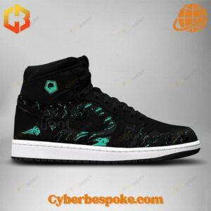 Rin Itoshi Blue Lock Air Jordan 1 High sneakers with black leather upper, teal graphics, Jumpman logo, and Blue Lock emblem.