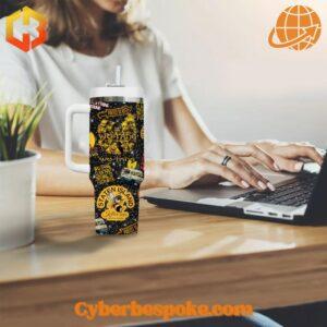 Wu-Tang Clan Staten Island Tumbler 40oz on a desk beside a laptop.